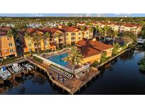 Aerial view of condo building with pool and marina at 5000 Culbreath Key Way # 4-206, Tampa, FL 33611