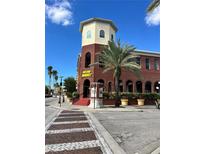 Brick building with palm trees and a street view at 1910 E Palm Ave # 13102, Tampa, FL 33605