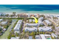 Aerial view of the property near the water at 94 The Cove Way, Indian Rocks Beach, FL 33785