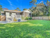 Charming home with a spacious backyard, perfect for outdoor entertaining at 364 Terrace Rd, Tarpon Springs, FL 34689