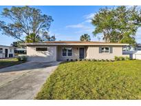 Charming ranch-style home with a well-maintained lawn at 10721 64Th Ave, Seminole, FL 33772