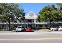 Exterior view of a two-story apartment building with parking at 2100 World Parkway Blvd # 58, Clearwater, FL 33763