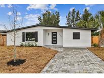 Beautifully renovated home featuring modern design and a landscaped front yard at 5908 S Manhattan Ave, Tampa, FL 33616