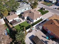 Aerial view of a house with a backyard, lawn, and hot tub at 507 79Th Ave, St Pete Beach, FL 33706