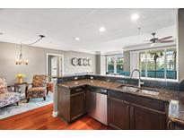 Open kitchen featuring granite countertops, stainless appliances, and a seamless flow to the living spaces at 345 Bayshore Blvd # 308, Tampa, FL 33606