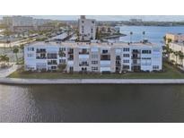 Aerial view of a waterfront condominium building at 7625 Sun Island S Dr # 305, South Pasadena, FL 33707