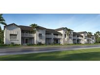 Modern apartment building with balconies and palm trees at 19015 Scallop Loop # 102, Lakewood Ranch, FL 34202