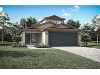 Two-story house with a two car garage, landscaping and driveway at 29666 Fedora Cir, Brooksville, FL 34602