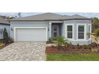 Charming single-story home featuring a brick driveway and well-maintained landscaping at 11517 Waterway Dr, Parrish, FL 34219