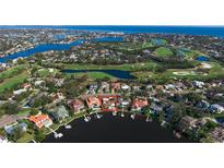 Aerial view showcasing waterfront property with a golf course nearby at 1348 Monterey Ne Blvd, St Petersburg, FL 33704