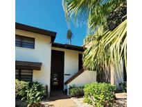 Condo building exterior with entrance and landscaping at 4632 Red Maple Rd # 1204, Bradenton, FL 34210