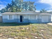 Ranch style home with a two-car garage at 4718 Blossom Dr, Holiday, FL 34690