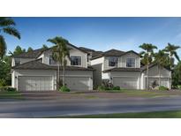 Modern townhouses with attached garages and lush landscaping at 19205 Cherrystone Way # 104, Lakewood Ranch, FL 34202