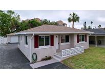 Charming single-story home with a carport and well-maintained lawn at 3505 Casablanca Ave, St Pete Beach, FL 33706