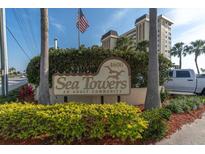 Sea Towers adult community sign with building in background at 4575 Cove Cir # 202, St Petersburg, FL 33708