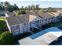 Complex of condo buildings, parking and landscaping at 4805 Sunnybrook Dr # 21, New Port Richey, FL 34653