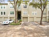 Townhouse with two-car garage and a spacious driveway in a lush setting at 760 Coral Reef Dr, Tampa, FL 33602