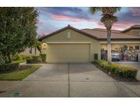 Charming home with two-car garage and landscaped front yard at 5641 Sunset Falls Dr, Apollo Beach, FL 33572
