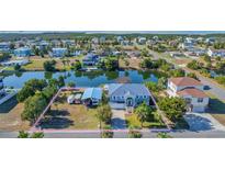 Aerial view of waterfront home with large lot and detached garage at 3295 Hibiscus Dr, Hernando Beach, FL 34607