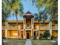 Inviting condo building with palm trees and a well-maintained entrance at 2292 Austrian Ln # 34, Clearwater, FL 33763
