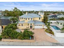 Luxury waterfront home with pool and private dock, offering stunning canal views at 231 21St Ave, St Pete Beach, FL 33706