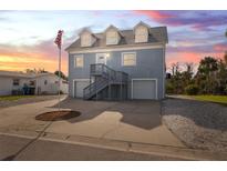 Two-story house with double garage and a spacious driveway at 4148 Rudder Way, New Port Richey, FL 34652