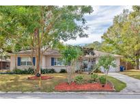 Charming single story home with mature landscaping and a spacious front yard at 1008 Chester Dr, Clearwater, FL 33756