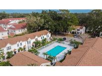 Aerial view of a community pool and surrounding townhouses at 2302 Maki Rd # 5, Plant City, FL 33563