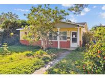 Charming mid-century home with a manicured lawn and walkway at 4426 4Th N Ave, St Petersburg, FL 33713