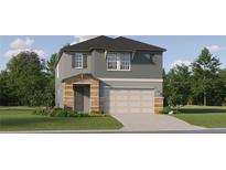 Two-story house with gray siding, stone accents, and a two-car garage at 7040 E 119Th Ct, Palmetto, FL 34221