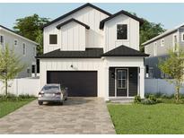 Two-story modern farmhouse with black accents and a paved driveway at 3819 71St N St, St Petersburg, FL 33709