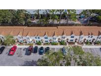 Aerial view of townhouses with parking and landscaping at 2302 Maki Rd # 62, Plant City, FL 33563