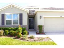 Attractive one-story home with stone accents and landscaping at 11946 Cross Vine Dr, Riverview, FL 33579