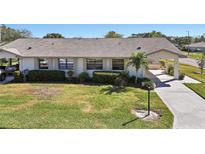 Single-story home with a paved driveway and well-maintained lawn at 2122 Hereford Dr # 511, Sun City Center, FL 33573
