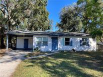 Cute one-story home with carport and mature landscaping at 4315 Berkley Dr, Tampa, FL 33610