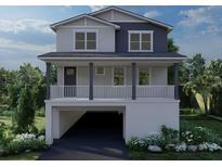 Two-story home with attached garage and front porch at 4010 Huntington Ne St, St Petersburg, FL 33703