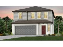 Two-story home with gray siding, brown roof, and a two-car garage at 9808 Crescent Moon Dr, Riverview, FL 33578