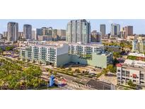 Aerial view of a modern condo building in a vibrant city setting at 912 Channelside Dr # 2320, Tampa, FL 33602