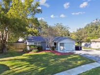 Ranch style home with mature landscaping and a spacious yard at 918 Windward Way, Palm Harbor, FL 34685