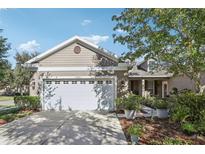 Charming one-story home with a two-car garage and well-manicured landscaping at 16020 Starling Crossing Dr, Lithia, FL 33547