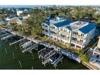 Aerial view of waterfront property with private boat docks at 219 18Th Ave, Indian Rocks Beach, FL 33785