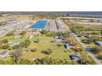 Aerial view of property and surrounding area at 712 21St Se Ave, Ruskin, FL 33570