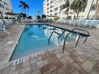 Refreshing community pool with plenty of lounge chairs at 2960 59Th S St # 411, Gulfport, FL 33707