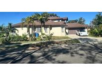 Two-story house with a large yard and attached garage at 4015 Woodacre Ln, Tampa, FL 33624