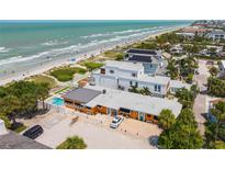 Aerial view of beach house with pool, and ocean at 1600 Beach Trl, Indian Rocks Beach, FL 33785