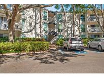 Bayboro Towers condo building exterior with ample parking and lush landscaping at 3325 Bayshore Blvd # D21, Tampa, FL 33629