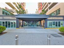 Grand Central building entrance with modern canopy and sidewalk at 1208 E Kennedy Blvd # 725, Tampa, FL 33602