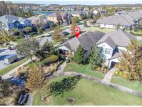 Aerial view of a house in Starkey Ranch community, showcasing the neighborhood and surrounding landscape at 3004 Abrams Trl, Odessa, FL 33556