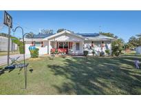 Charming single story home with a well-maintained lawn and solar panels at 38919 3Rd Ave, Zephyrhills, FL 33542