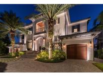 Elegant two-story home with a grand entrance and meticulous landscaping at 5120 W Longfellow Ave, Tampa, FL 33629